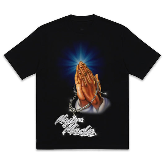 Black t-shirt with praying hands graphic and 'Major Made' text on a white background
